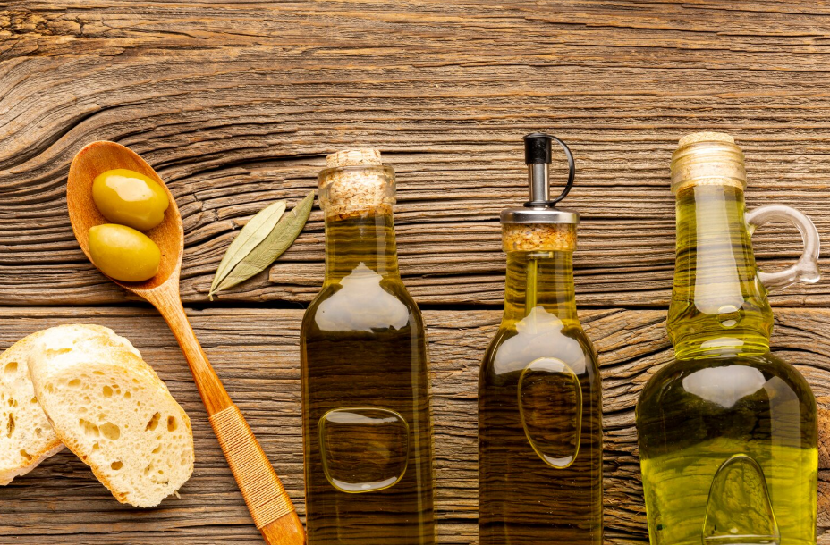 Three bottles of olive oil with bread slices, illustrating healthy cooking oil options.